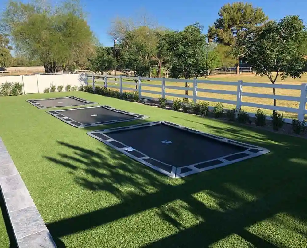In-ground trampoline installed flush with the yard in Texas