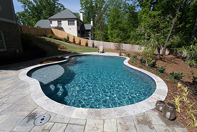 Remodeled freeform pool with mini pebble finish in Dallas